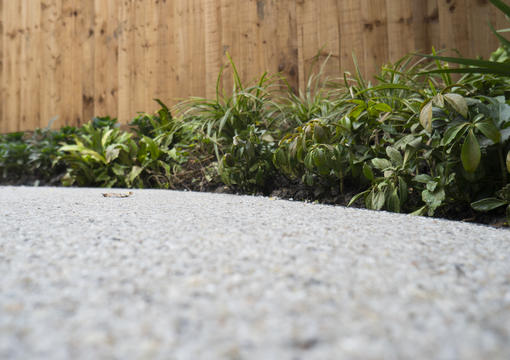Resin Bound Driveway With Leaf On Surface For Maintenance